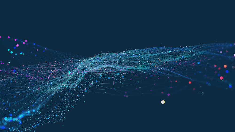 Many thin blue and purple lines connecting together various nodes / dots